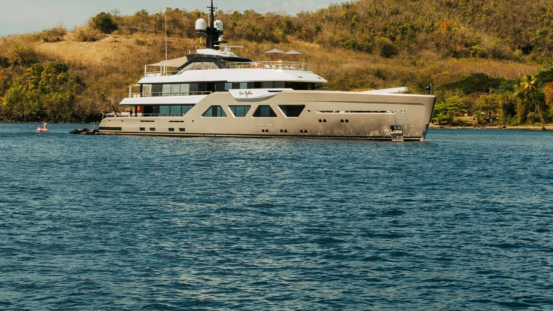A luxury superyacht at anchor on open water — UK Certificate of Competency verification
